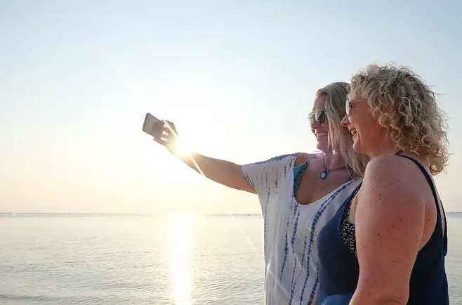 two women enjoying a day on the water
