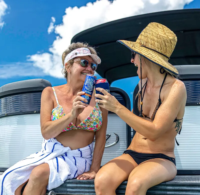 two women enjoying a day on the water